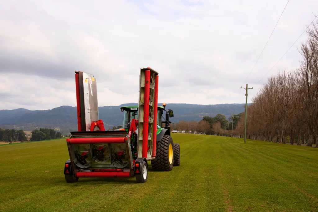 Farm tractor mowing